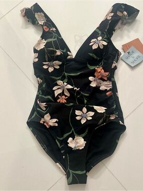 NWT.  XS elegant swimsuit with  rash guard